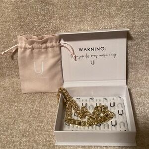 Brand new gold plated Uncommon James costume necklace.